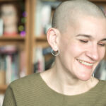 April’s Headshot Oct ’24 - A headshot of April caught mid-laugh.